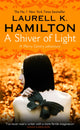 Book cover of: Shiver of Light. By: Laurell K. Hamilton