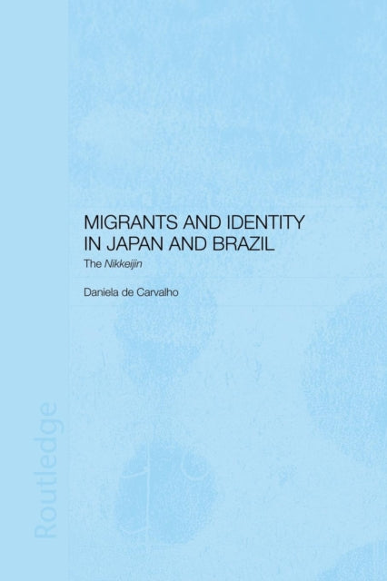 Book cover of: Migrants and Identity in Japan and Brazil. By: Daniela De Carvalho